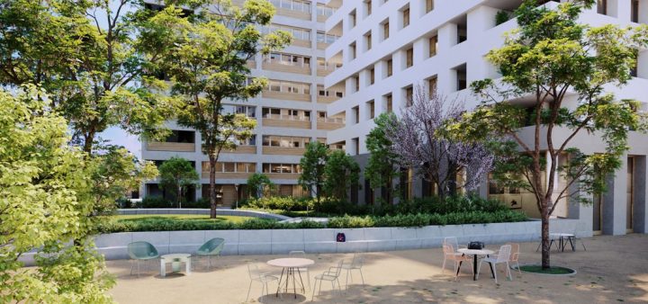 Réinventer la ville : Ici, un vaste jardin collectif et arboré avec terrasse, au cœur d'immeubles d'habitation modernes.